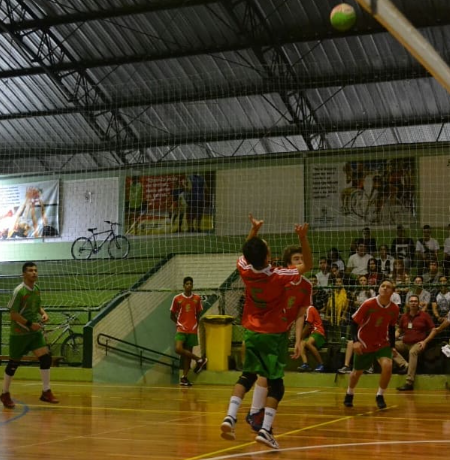 Player jumping towards the ball to do a set